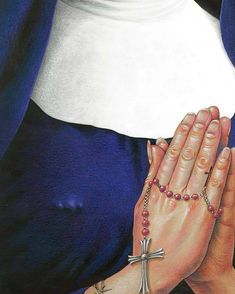 a painting of a woman holding her hands together with a cross on the other hand