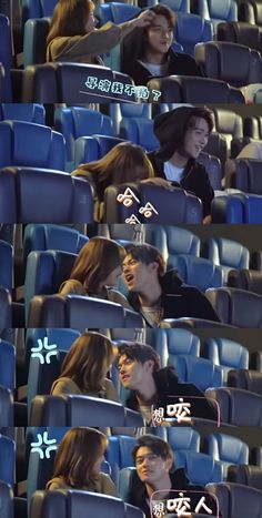 two people are sitting in an auditorium with blue seats and one is kissing the other