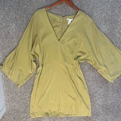 Brand New H&M Flowy Dress. Has A V-Shaped Neck On The Front. Zipper Is On The Back. Flowy Arms And Flowy Dress. Mini Dress. It Is A Yellow/Green Color. Spring Mustard V-neck Mini Dress, Mustard Flowy V-neck Dress, Spring V-neck Mustard Mini Dress, Mustard V-neck Mini Dress For Day Out, Mustard V-neck Flowy Dress, Yellow V-neck Mini Dress For Date Night, Yellow Green Dress, Blue Sundress, White Lace Mini Dress