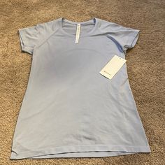 Short Sleeve Lululemon Shirt New With Tags. Blue Short Sleeve Tops For Light Exercise, Blue Crew Neck Top For Light Exercise, Light Blue Short Sleeve Tops For Workout, Light Blue Athleisure Tops For Light Exercise, Light Blue Casual Tops For Light Exercise, Unrealistic Wishlist, Anna Claire, Lulu Lemon Shorts, Practice Clothes