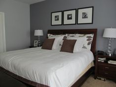 a large bed sitting in a bedroom next to two lamps on either side of it