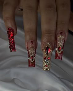 Red and gold prom freestyleeee Book your next nail appt today! @bratcrylix - Not able to book? Order your next custom made press on set @bratcrylix with the order form in my bio! Check "press ons" highlight for more info🤗 - #atlnails #atlnailtech #atlnailsalon #atlantanails #atlantanailsalon #atlantanailtech #cummingganails #cummingganailsalon #cummingnails #cummingnailtech #alpharettanails #alpharettanailtech Nails For Quinceanera Red, Red Nail Designs For Quince, Red And White Nails With Rhinestones, Red Quince Nails Almond, Red And Gold Prom Makeup, Red And Gold Prom, Red Nails Ideas Quince, Red And Gold Bling Nails, Acrylic Nails Xmas