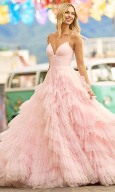 Promote attention-grabbing style in this stunning Sherri Hill 55461 creation. This absolutely charming gown showcases a sleeveless ruched bodice with a deep v-neckline, spaghetti straps and a v-open back. A tonal ruched band embraces the waist to accentuate your curves. Crafted in a multi-tiered ruffled tulle, the skirt flares a voluminous ballgown silhouette in a full length hem and sweeping train. Leave everyone speechless when you enter the room in this Sherri Hill 55461 masterpiece. Model is Mitzvah Dresses, Bat Mitzvah Dresses, Tulle Ballgown, Special Occasion Gowns, Train Party, Layered Tulle Skirt, Bridal Jumpsuit, Evening Dress Fashion, Pink Tulle