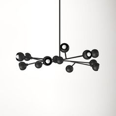 a black chandelier hanging from the ceiling