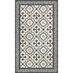 a rug with black and white designs on the front, in an ornate design pattern