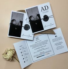 three wedding cards on top of each other next to a flower and some papers with the same photo