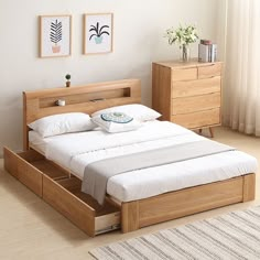 a bed with drawers underneath it in a bedroom