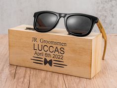 a wooden box with sunglasses on top of it that reads, mr groomsmen lucas