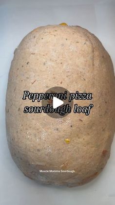 an image of pepperoni pizza sourdough loaf on a white background with the words pepperoni pizza sourdough loaf