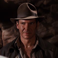 a man wearing a hat and jacket in a scene from the movie indiana jones, which is currently on dvd