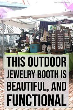 this outdoor jewelry booth is beautiful, and functional with its own unique sign on it