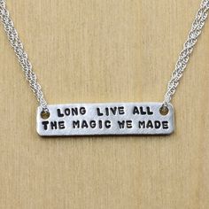 "Long live all the magic we made" is handstamped on a sterling silver bar, and hangs on sterling silver rope chain to create this ode to friendship necklace. Perfect gift for a best friend or fellow Swiftie.  Bar measure approximately 1" x 1/4". Inspirational Adjustable Hand Stamped Necklace, Inspirational Hand Stamped Adjustable Necklace, Meaningful Sterling Silver Friendship Necklace, Meaningful Sterling Silver Necklace For Friendship, Adjustable Engraved Meaningful Charm Necklaces, Adjustable Stamped Sterling Silver Charm Necklaces, Adjustable Sterling Silver Stamped Charm Necklace, Inspirational Silver Adjustable Necklace, Adjustable Silver Inspirational Charm Necklace