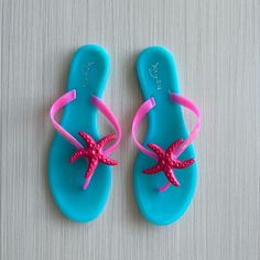 Jelly Or Plastic Flat Thong Sandal In Size 10 Or Euro 41, New Condition Never Worn, No Tags. Slip On Thong Style In Turquoise Blue With Fuchsia Pink Straps With Starfish Accent, By Keyza, Weighs 12 Ounces. Adjustable Flat Jelly Sandals For Beach, Adjustable Jelly Sandals For Summer Beach, Adjustable Jelly Sandals For Beach In Summer, Adjustable Summer Jelly Sandals For Beach, Adjustable Summer Jelly Sandals For Beach Season, Adjustable Jelly Sandals For Beach Vacation, Adjustable Flat Jelly Sandals For Beach Season, Summer Jelly Sandals For Beach Season, Beachy Open Toe Flip Flops For Poolside