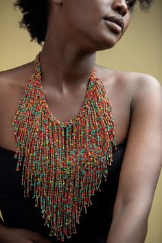 Unique African Maasai Handcrafted Beaded Necklace with an Elegant Look and Brilliant Finish. Circumference = 16 Inches/ 41 Centimeters. Color =Multi-Color Maasai Beads. Fringe = 10 Inches / 26 Centimeters. **GET FREE SHIPPING FOR ADDITIONAL ITEMS PURCHASED. Yes, Buy Multiple Items and pay shipping for 1 item only- The rest ships Free. (No Limits on the number of Multiple items). With a faster delivery time of 3 days via DHLExpress, Worldwide. Ordinary/Standard Shipping also available upon reques Fabric Beads Jewelry, Multicolor Large Beads Necklace For Festival, Multicolor Beaded Chain For Festival, Multicolor Large Beads For Festival, Multicolor Wooden Beads For Festival, Festival Multicolor Large Beaded Necklaces, Festival Multicolor Large Beads Necklace, Multicolor Polished Beads Jewelry For Festival, Multicolor Beaded Necklace For Festival