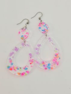 Our range of confetti poppers earrings are set to bring fun back to your outfit (and life).  This boutique range of confetti earrings will be the talk of the town in no time and being some 80s and 90s nostalgia back to life. Plastic Drop Earrings For Party, Cute Plastic Party Earrings, Funky Drop Earrings For Party, Trendy Rainbow Earrings For Party, Fun Plastic Jewelry For Party, Multicolor Plastic Earrings For Party, Fun Plastic Party Jewelry, Colorful Funky Earrings For Party, Funky Multicolor Earrings For Parties