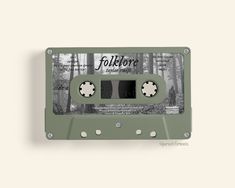 an old green cassette with the words folklore printed on it and two holes in the side