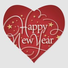 a heart shaped sticker with the words happy new year written in white and gold stars