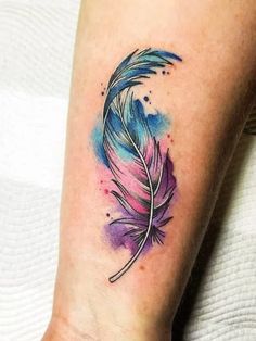 a watercolor feather tattoo on the ankle