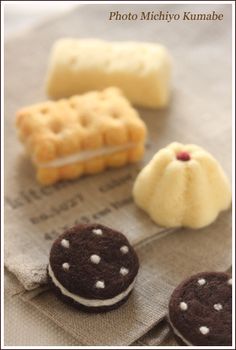 four different types of pastries sitting on top of a piece of paper