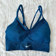 Nike Sport Bra New Without Tags Stretchable Blue Seamless Sports Bra, Blue Stretch Seamless Fabric Sports Bra, Nike Seamless Sports Bra For Training, Nike Sporty Seamless Activewear, Blue Seamless Activewear For Sports, Blue Athleisure Activewear In Seamless Fabric, Blue Seamless Activewear For Running, Blue Seamless Athleisure Activewear, Blue Seamless Fabric Sports Bra For Workout