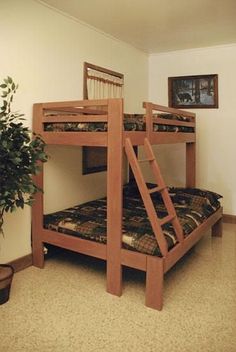 there is a bunk bed with two sets of ladders on the top and bottom