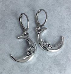 These simple Whimsigoth inspired earrings feature 21x15mm antiqued silver toned crescent moon charms that dangle from 10mm dark silver toned round, hoop leverback earwires. Including the earwires, these measure about 1 1/4 inches. I love these moon charms- they have adorable faces etched into them! These would look wonderful paired with a matching silver toned crescent moon necklace, shown in the last picture, and also available in my shop:  https://www.etsy.com/listing/1447454197/crescent-moon-whimsigoth-necklace-with?ref=listings_manager_grid Thank you so much! Silver Moon Jewelry, Whimsigoth Necklace, Moon Earrings Silver, Silver Moon Earrings, Grunge Earrings, Simple Silver Earrings, Crescent Earrings, Moon And Star Earrings, Crescent Moon Earrings