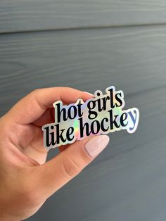 "Full color print Waterproof Dishwasher safe Smooth Matte finish Introducing our newest product for hockey fans, the holographic sticker featuring the phrase \"Hot Girls Like Hockey\" Measuring at 3.0\" by 1.5\", this sticker is perfect for showing off your love for the game of hockey. The sticker is made with high-quality, waterproof materials, ensuring that it will withstand even the toughest conditions." Hockey Diy, Ny Islanders, Hockey Goals, Hockey Pictures, Stars Hockey, Hot Hockey Players, Volleyball Quotes, Hockey Season, Hockey Humor