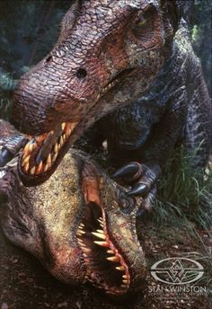 an image of two dinosaurs with their mouths open