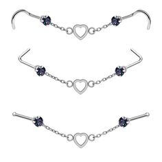 three different piercings with hearts and heart shaped beads on each end, one is attached to