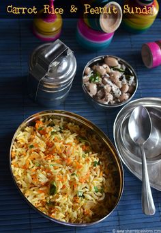 carrot rice and peanut sundae with spoons on blue mat next to bowls of food