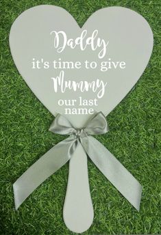 a wooden heart with the words daddy it's time to give mommy our last name