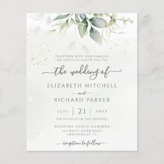 an elegant wedding card with greenery on it