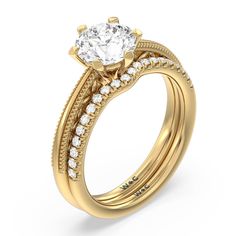 a yellow gold engagement ring set with a round diamond