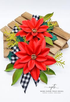 the paper poinsettis are sitting on top of each other