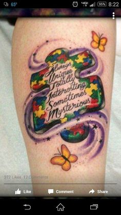 a woman's leg with a colorful tattoo on it