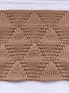 a close up of a knitted piece of cloth