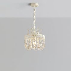 a white chandelier hanging from the ceiling