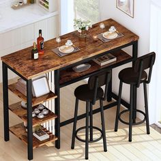 a kitchen table with three stools next to it