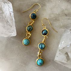 by Robindira Unsworth Handmade at our design studio in California One-of-a-kind 14k gold vermeil Chrysocolla, white topaz Drop: 2" Please note: stones are one-of-a-kind and may vary slightly Style No. E1450-G Gold Earrings With Gemstone Accents In Sterling Silver, Artisan Chrysocolla Jewelry With Polished Beads, Artisan Gold Chrysocolla Jewelry, Turquoise Polished Chrysocolla Beads Jewelry, Artisan Blue Chrysocolla Jewelry, Bohemian Chrysocolla Pendant Jewelry, Unique One-of-a-kind Chrysocolla Jewelry, Gold Vermeil Jewelry, Labradorite Ring