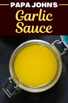 garlic sauce in a glass bowl with text overlay that reads papa john's garlic sauce