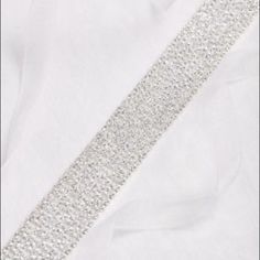 A Fine Mesh Of Glittering Pave Crystals Forms This Glitzy Sash, But Its Simple Shape Keeps The Vibe Elegantly Understated. Finished With Organza Ribbon. Nylon, Brass, Crystal Tie Closure 84"L Sash; 66"L, 0.5"W Ribbon And 18"L, 0.75"W Embellishment Sash Belts, Bridal Belt, Organza Ribbon, Sash Belt, The Vibe, Davids Bridal, Simple Shapes, Bridal Accessories, Wedding Hair