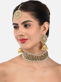 This jewellery set consists of a necklace, pair of earrings and a maang tikkaGold-toned and white kundan stone & pearl studded statement necklace, secured by a drawstring closureA pair of matching jhumkas, secured with a post-and-back closureA matching maang tikka, secured with a hook closure Size & Fit Necklace Length- 44 cmEarring Length- 6.5 cmMaangtikka Length- 15 cm Material & Care Alloy Indian Jewelry Gold, Pearl Jewelry Set, Kundan Necklace Set, Maang Tikka, Kundan Necklace, Pearl Jewelry Sets, Kundan Necklaces, Gold Jewelry Indian, Jewellery Set