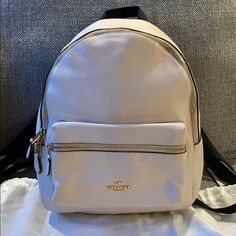 This Coach Backpack Is Absolutely Beautiful. It Has Only Been Used Less Than A Handful Of Times. The Interior And Exterior Are So Clean It Looks Brand New. The Straps Are Adjustable And So Comfortable. It Has The Main Compartment With A Zipper Inside. Then A Front Zipper Compartment As Well. The Interior Is A Dark Brown. The Exterior Is An Off White/Cream. It’s Beautiful White Leather Backpack With Dust Bag, Luxury White Leather Backpack With Adjustable Strap, White Luxury Leather Backpack For Daily Use, Luxury White Leather Backpack For Daily Use, White Luxury Backpack With Removable Pouch, Luxury White Backpack With Removable Pouch, Luxury Leather Backpack In Cream, Designer White Travel Backpack, Designer White Backpack For Travel