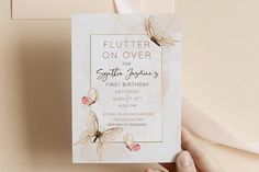 a person holding up a birthday card with flowers on it and the words flutterr on over