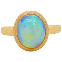 Stunning Australian opal set in a unique designer ring setting! This bold ring has a 2.29 carat oval shaped Australian opal gemstone set in gorgeous 18 karat brushed yellow gold! No two opals look alike and the fire and scintillation in this ring is amazing! Australian opals are good luck to wear and is perfect for a special birthday or a special anniversary! Don't you need some luck in your life and start a new beginning? Opal can help with that! The quality of this opal is dreamy and has vivid Opal Stone Ring, Unique Ring Designs, Australian Opal Ring, Sapphire Solitaire Ring, Black Opal Ring, Bold Rings, Sapphire Solitaire, Opal Ring Gold, Star Jewelry