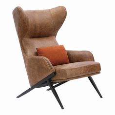 a brown leather chair with an orange pillow on it's back and black legs