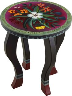 a small table with flowers painted on it