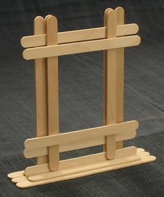 a small wooden easel on a black background