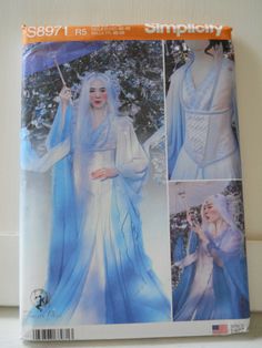 Simplicity S8971 H5 in sizes 6, 8, 10, 12 or 14 OR R5 sewing pattern in sizes 14, 16, 18, 20 and 22. This stunning kimono-like dress could be done in so many fabrics and color palates, but the pattern envelope shows an AAPI inspired ice or snow princess, queen, fairy or fantasy character. The dress is floor length with very long, flowing sleeves, V neck, fitted bodice and zipper back closure. There is an over-dress with cap sleeves, fitted bodice and open, flowing skirt that goes beyond floor le Ice Queen Costume, Fairy Gown, Tale Dress, Costume Sewing Patterns, Corset Pattern, Queen Costume, Costume Patterns, Simplicity Sewing, Fantasy Costumes