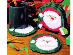 crocheted santa claus coasters and coffee cup cozyies on a wooden table